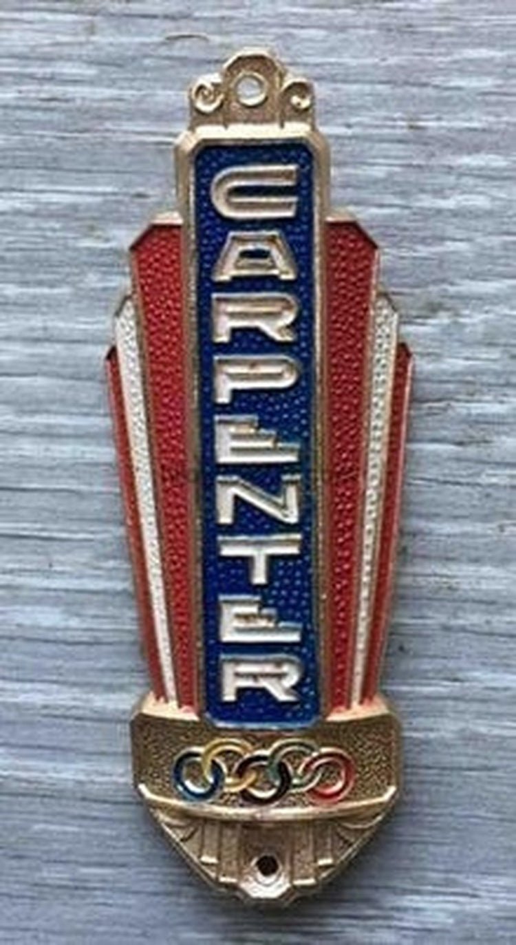 CARPENTER Metal Haed Badge - H Lloyd Cycles